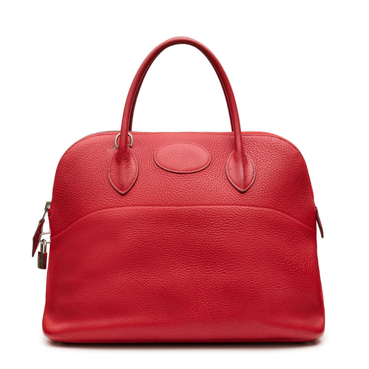 Hermès Red leather bolide handbag on a white background
