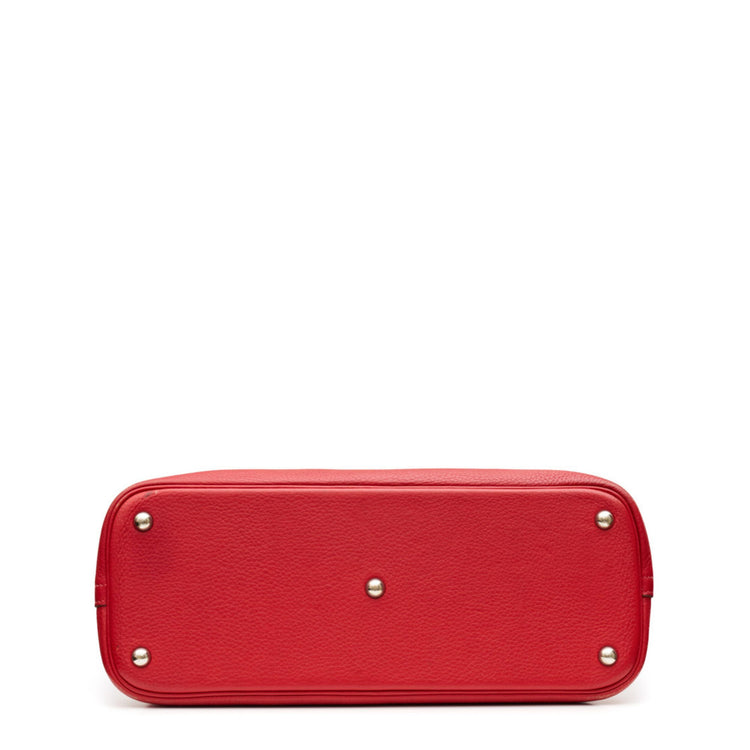 Hermès Red leather bolide handbag on a white background