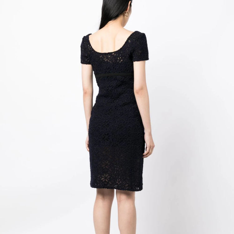 Prada floral lace empire waist dress with a fitted bodice and flowing skirt, perfect for elegant occasions.