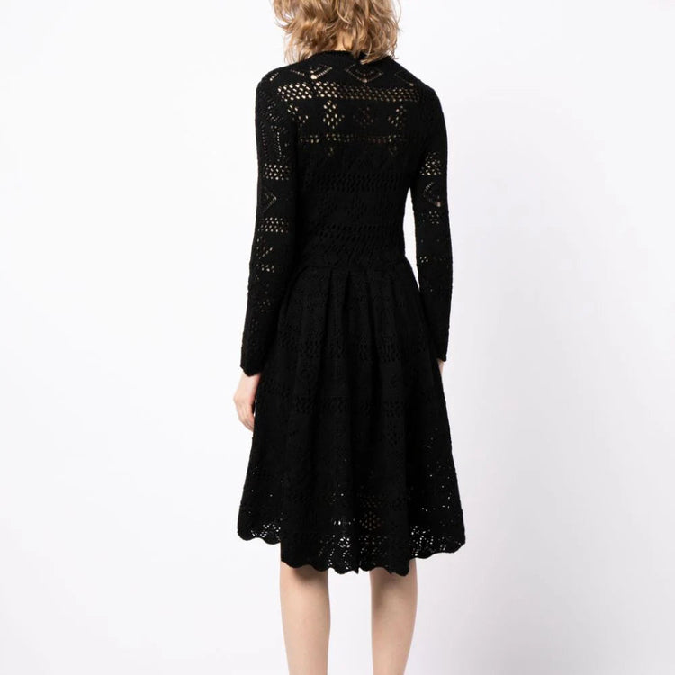 Prada long-sleeved crochet knit dress featuring intricate patterns and a fitted silhouette, modeled on a person.