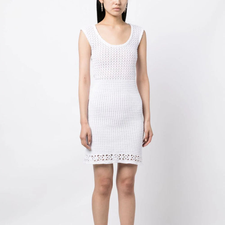 White Prada crochet knit dress with intricate crochet pattern, sleeveless design, and lightweight fabric perfect for summer wear.