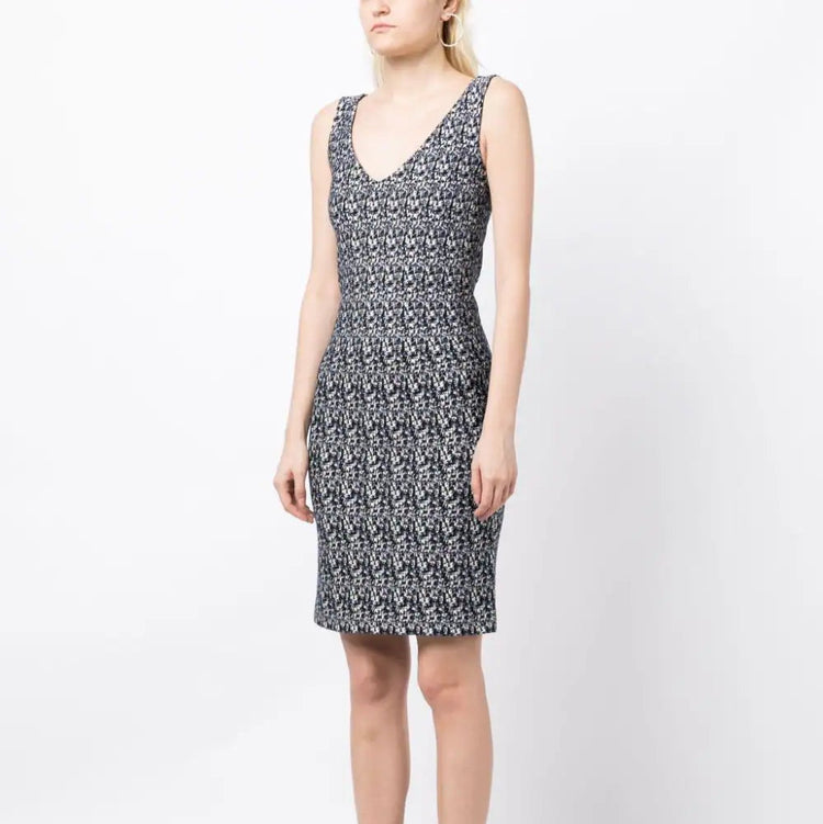 Prada abstract print compact knit dress featuring a stylish, fitted design with vibrant geometric patterns and a sleek silhouette.