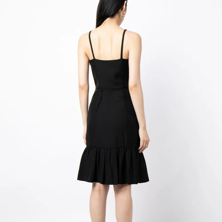 Prada ruffle hem crepe dress in navy with flowing silhouette and elegant details, shown on a model.