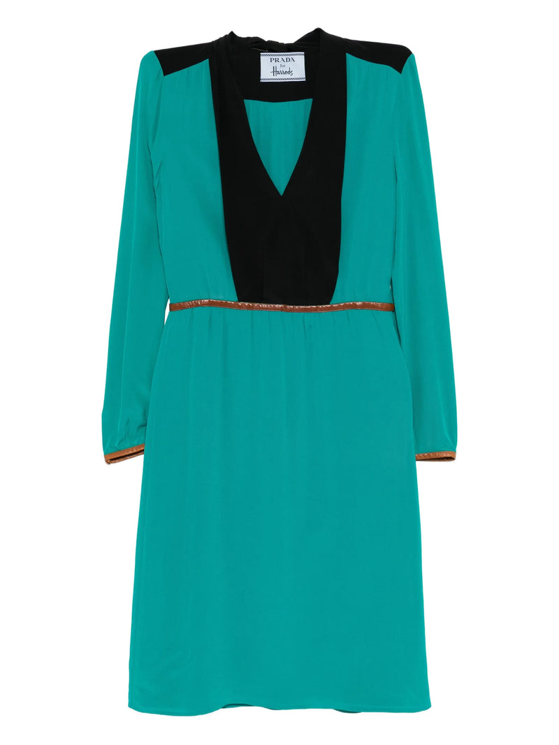 Prada teal dress with black accents on a white background