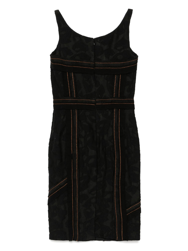 Prada Black dress with orange stitching on a white background