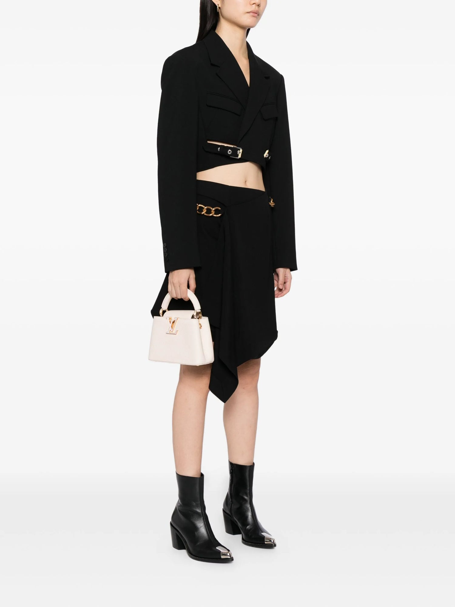 Person wearing a black outfit with a white background