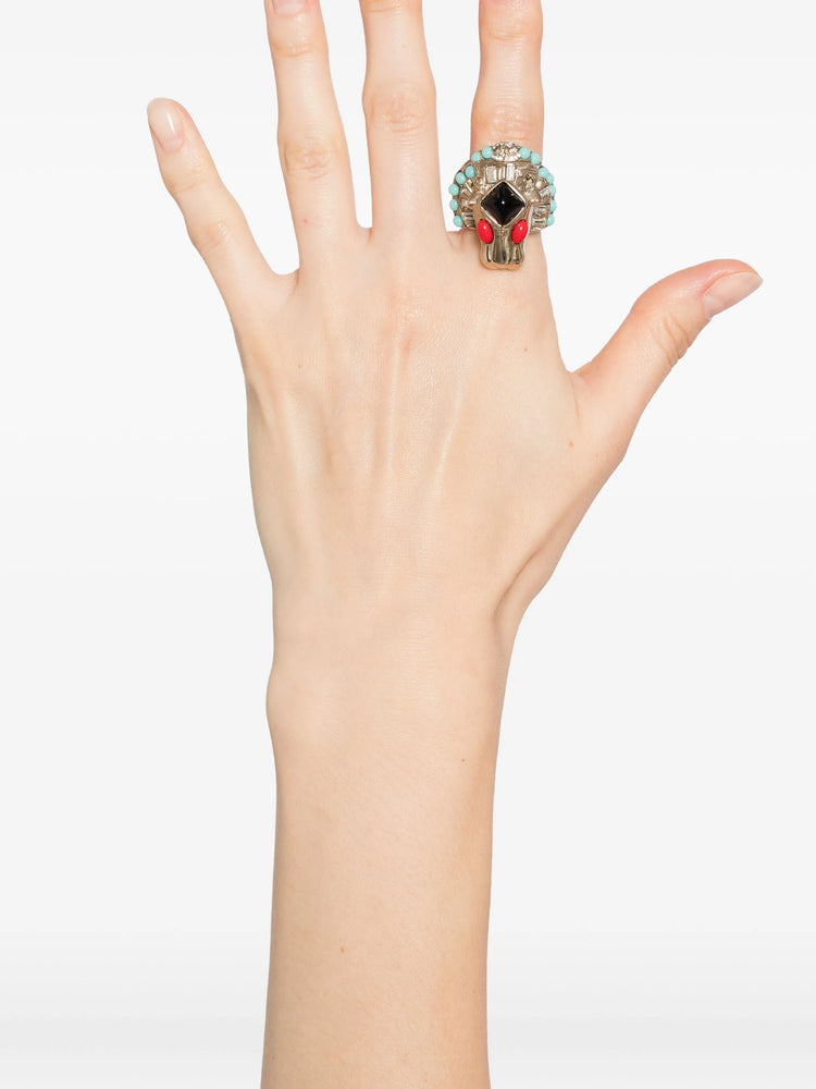 Chanel CC Lion Head Cocktail Ring with turquoise, black, and red stones on a white background