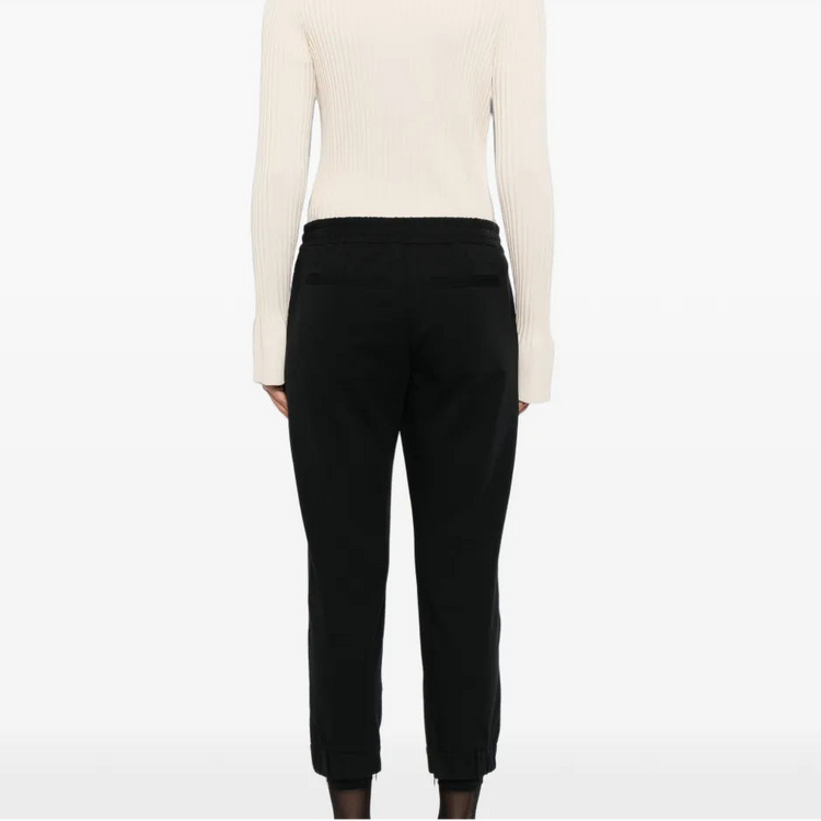 Back view of Brunello Cucinelli black jogger trousers, showcasing the relaxed fit and stylish waistband.