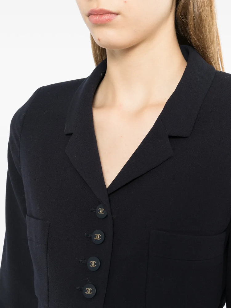 Navy wool Chanel blazer with silver CC buttons, 1996 design, tailored fit and classic style, front view with lapel collar.