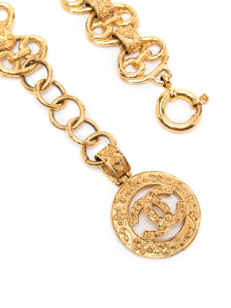 Chanel gold vintage belt with a classic buckle, stylish accessory for elegant outfits.
