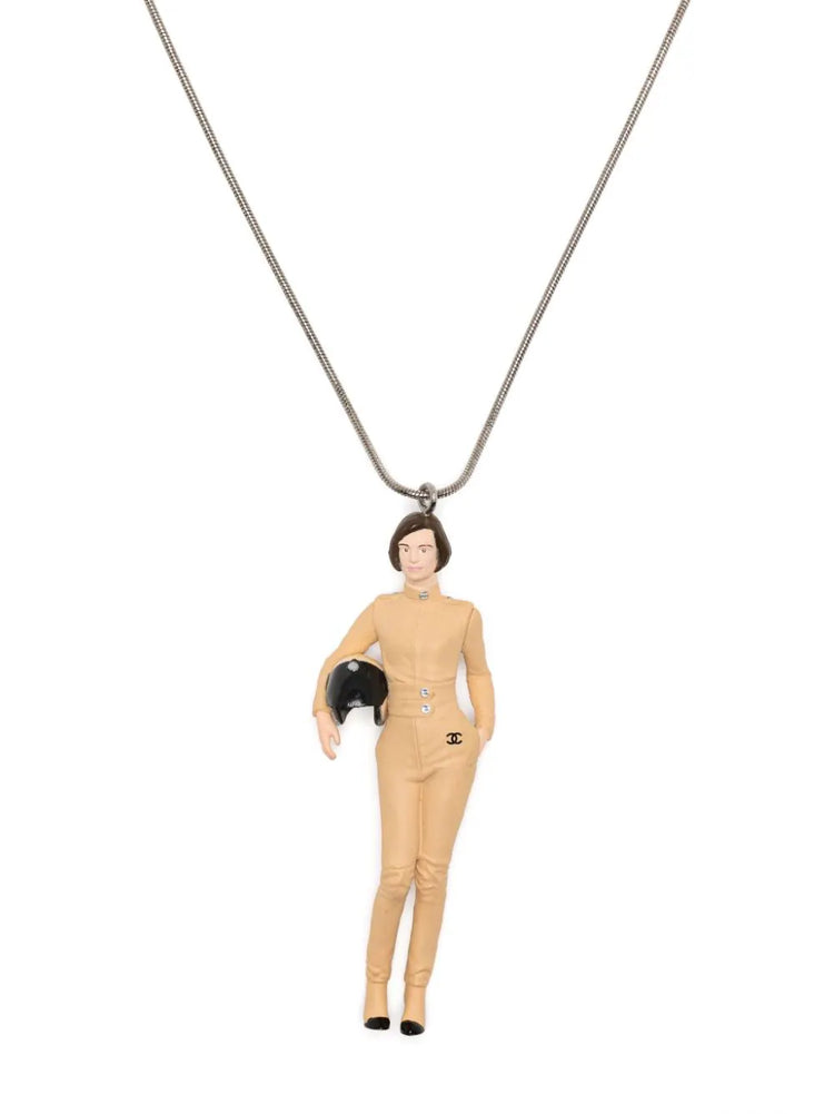 Chanel Keira Knightley doll pendant necklace featuring a detailed doll charm on a sleek chain.