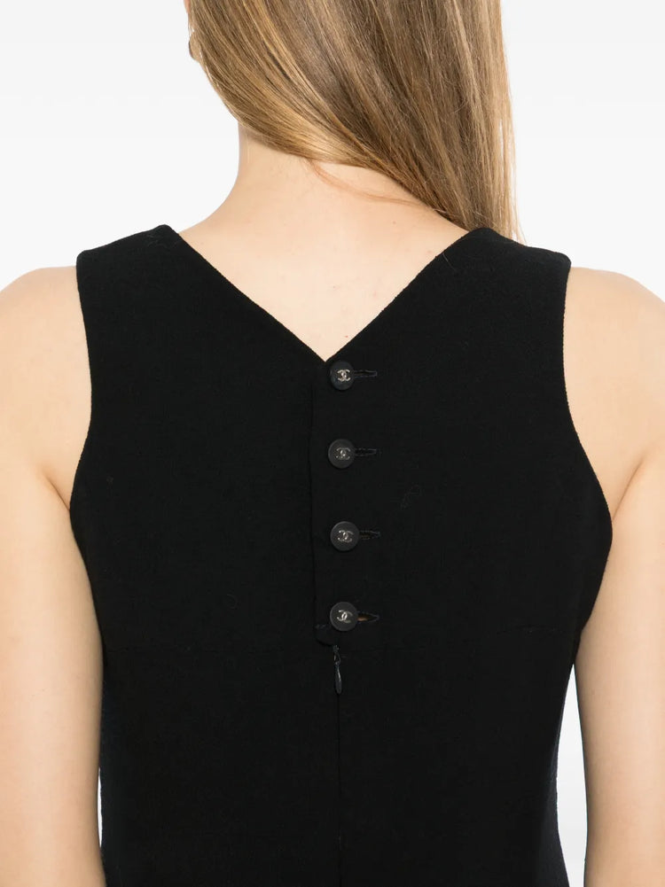 Black wool sleeveless sheath dress by Chanel featuring a fitted silhouette and classic design, perfect for elegant occasions.