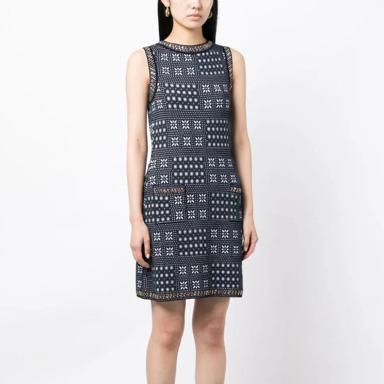 Navy and white Chanel winter knit dress with long sleeves and a cozy, stylish design perfect for cold weather.