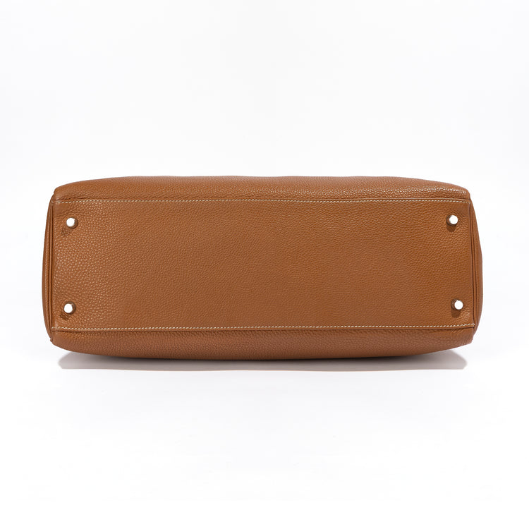 Hermès Kelly 40 Gold PHW top handle bag with gold hardware, showcasing elegant leather craftsmanship and structured design.