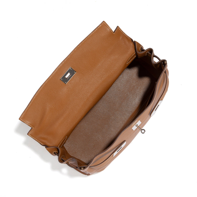 Hermès Kelly 40 Gold PHW handbag by Rewind Vintage Affairs with beige leather interior and gold hardware, stylish and luxurious.