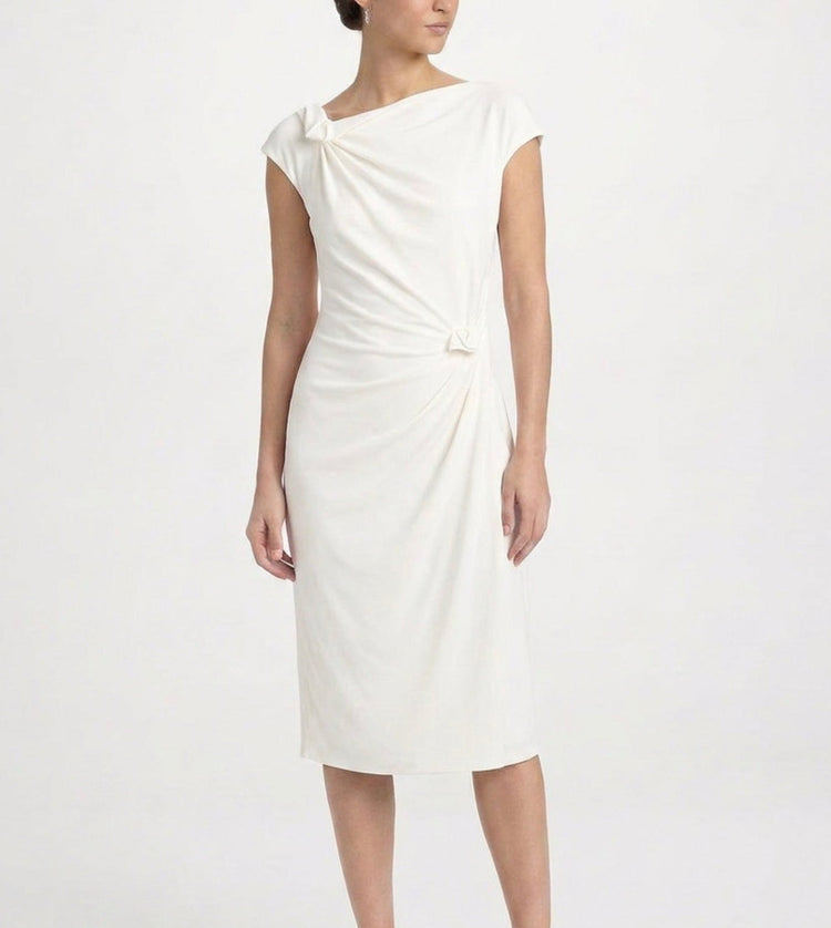 Prada Cream Rosette Dress featuring delicate fabric and floral rosette details, perfect for elegant occasions.