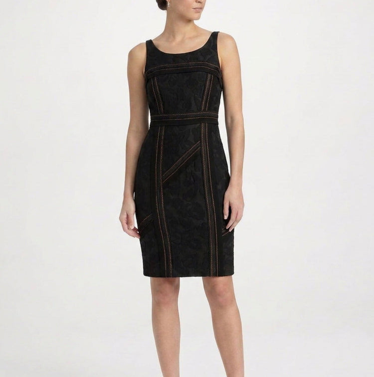 Black Prada corset dress with structured bodice and fitted silhouette, displayed on a hanger against a neutral background.