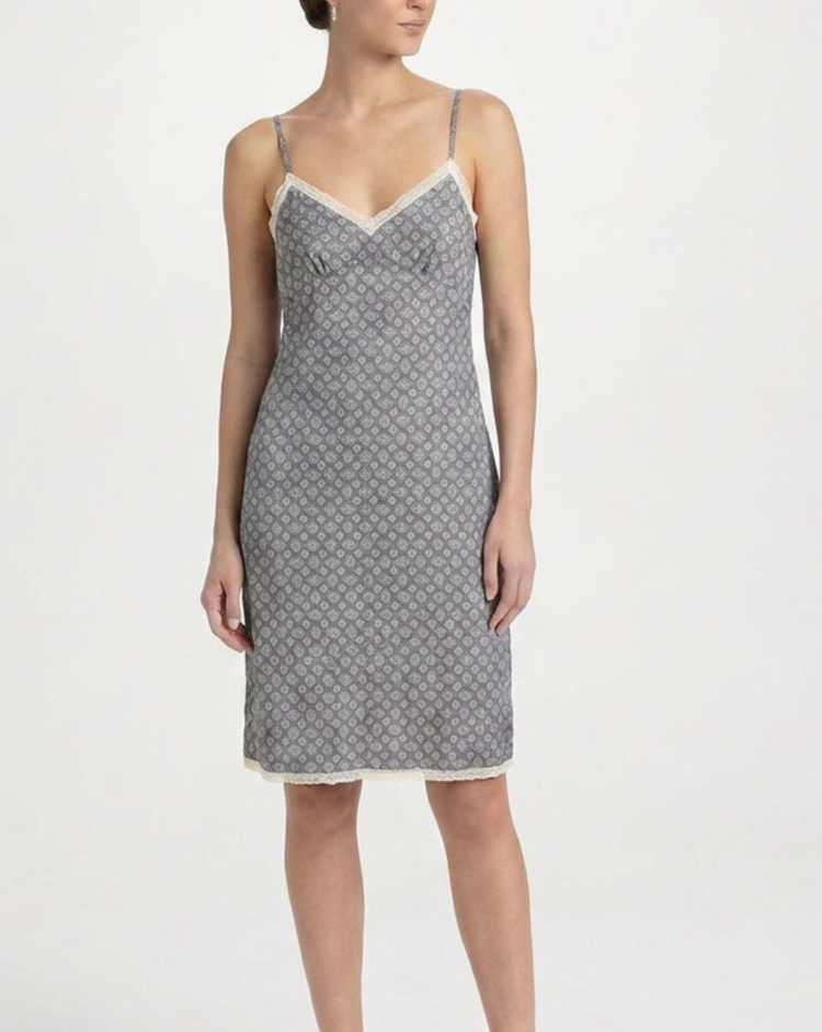 Prada blue silk slip dress hanging on a white background, showcasing smooth fabric and elegant design.