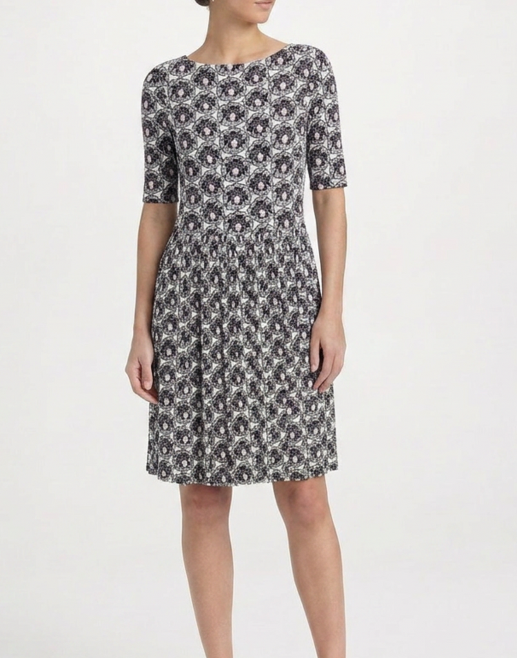 Prada printed silk gathered dress with flowing fabric and elegant design, featuring a vibrant pattern and stylish silhouette.