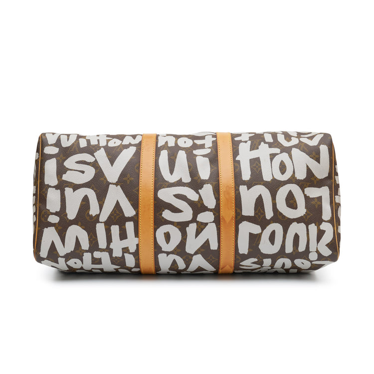 Louis Vuitton Stephen Sprouse Graffiti Keepall 50 travel bag with vibrant graffiti design and leather handles.