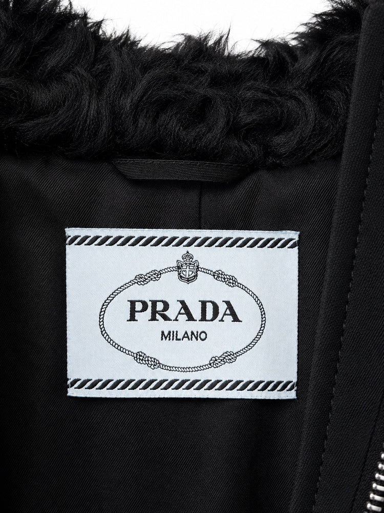 Black Prada cropped teddy jacket with label detail, stylish blazer with soft textured fabric and tailored fit.