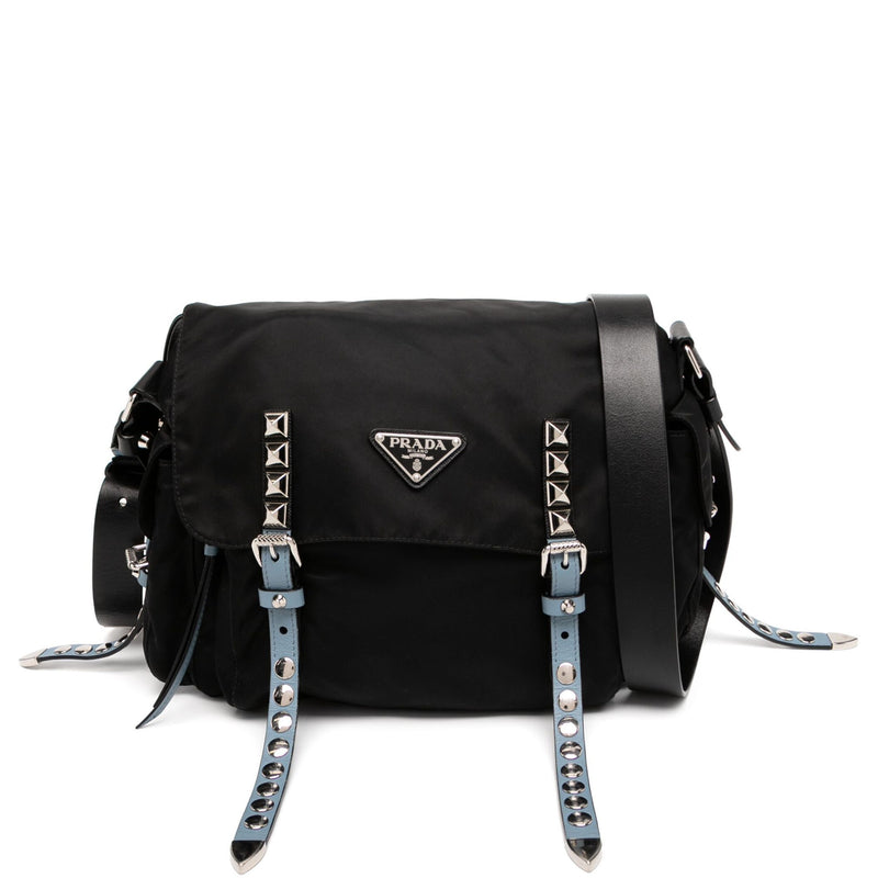 Prada studded shoulder bag with metal stud accents and leather strap showing on a neutral background.