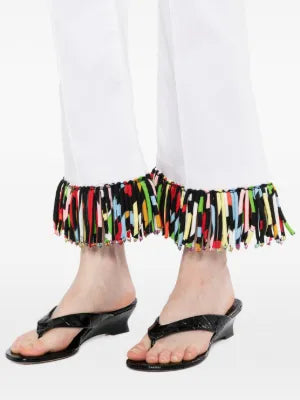 Pre-owned PUCCI fringed straight-leg jeans with distressed details and a classic denim wash, displayed on a neutral background.