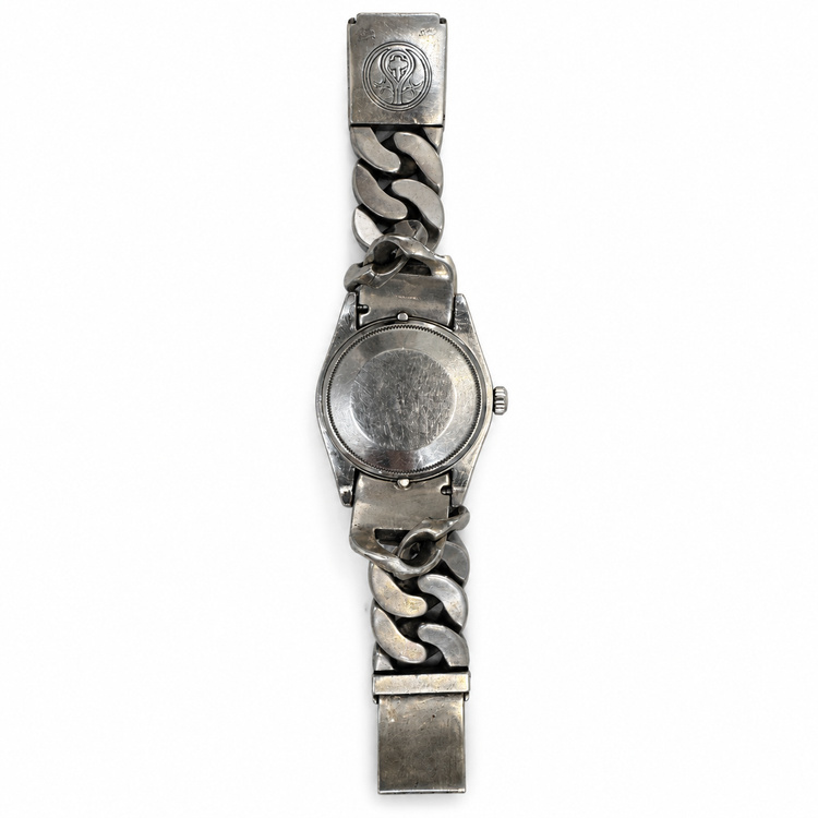 A Rolex x Loree Rodkin luxury watch silver-tone metal watch with a chunky Cuban link bracelet, shown from the back on a plain white background.