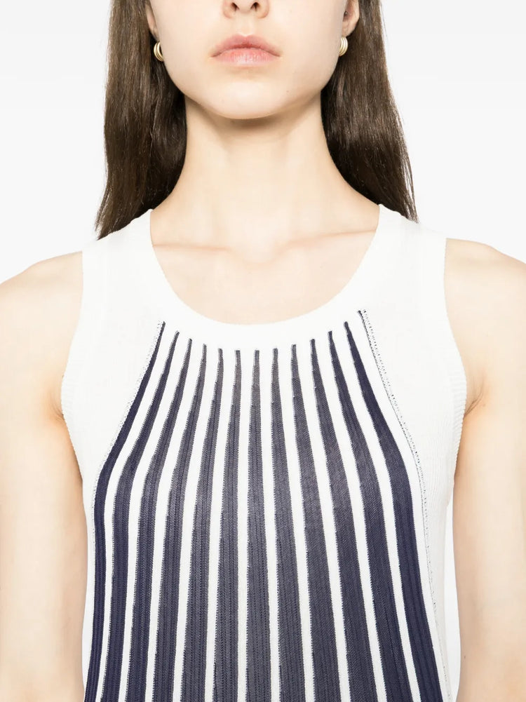 Close-up of a blue and white pleated striped dress by Chloé, showcasing the fabric texture and elegant design details.