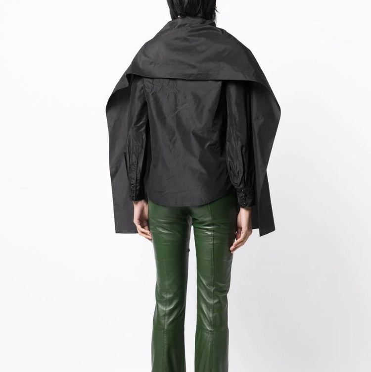 Black layered silk blouse from Yves Saint Laurent, stylish top with flowing fabric and elegant design.