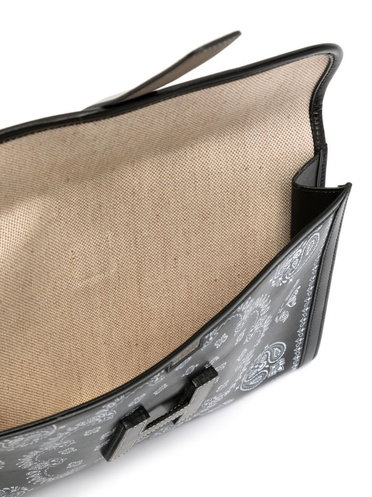 Hermès customised Bandana Jige Élan PM clutch in black Box leather with envelope silhouette, fold-over flap, H-tab closure and graphic bandana-inspired custom design.