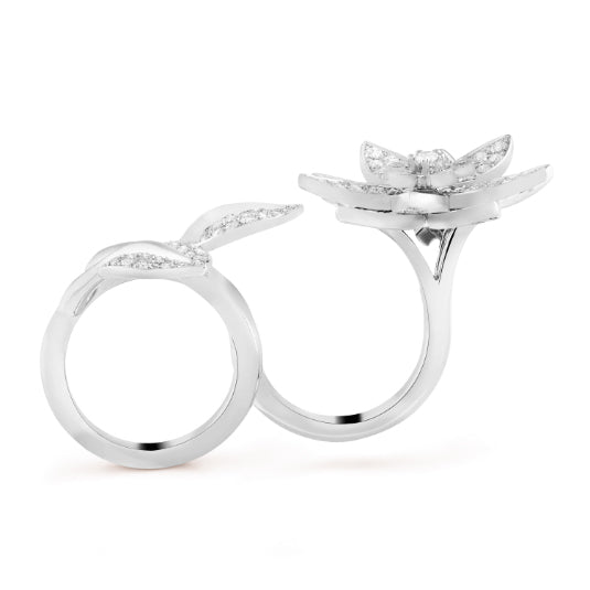 Diamond Lotus Between the Finger Ring by Van Cleef & Arpels featuring intricate design and sparkling diamonds on a delicate band.