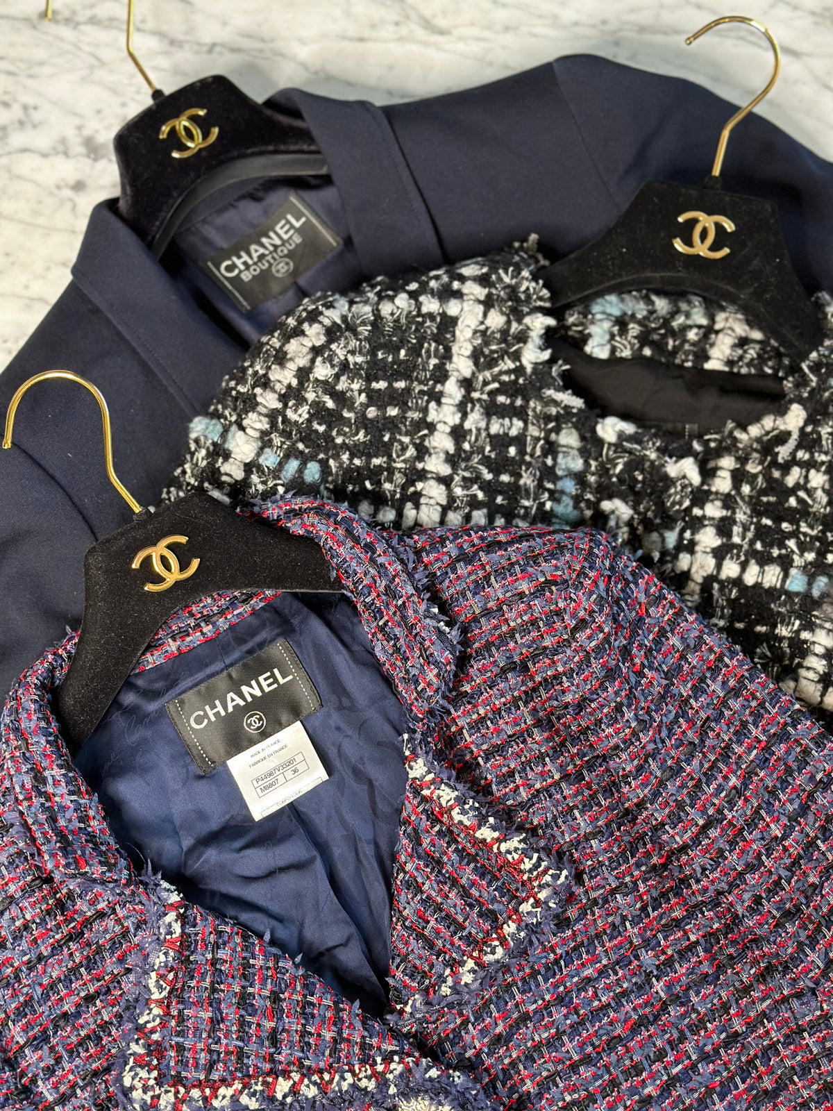 UNVEILING THE SECRETS BEHIND THE ICONIC CHANEL JACKET