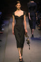Prada 2004 black wool midi dress with sweetheart neckline, cap sleeves, contrast piping, cut-out detailing, fitted waist, exposed back zip and structured silhouette.