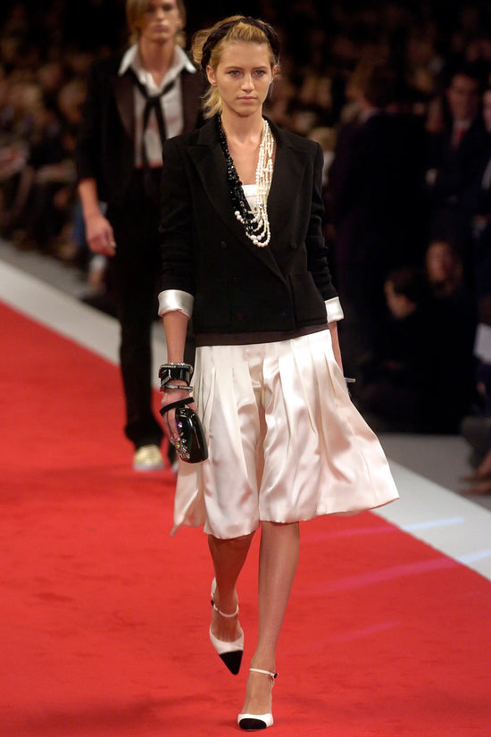 Chanel 2005 Jewel Black Resin Minaudière clutch with intricate design, perfect for evening occasions.