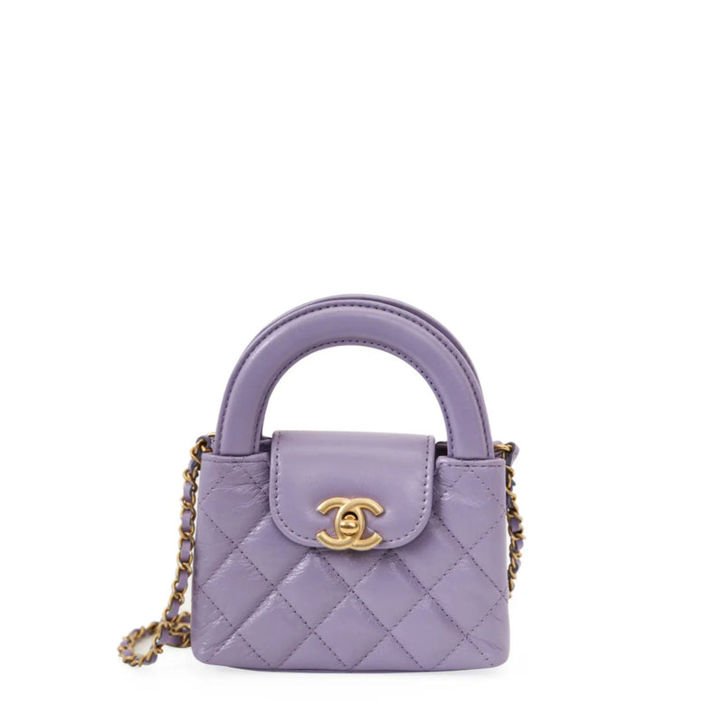 Purple quilted handbag with gold chain and logo on a white background
