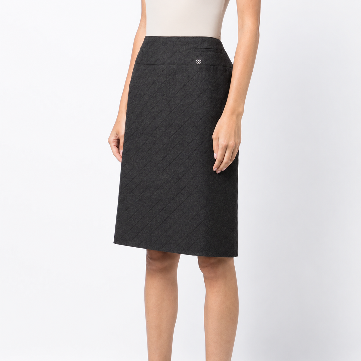 Chanel 2004 diamond-pattern pencil skirt with tailored fit and classic design, shown in a close-up image.