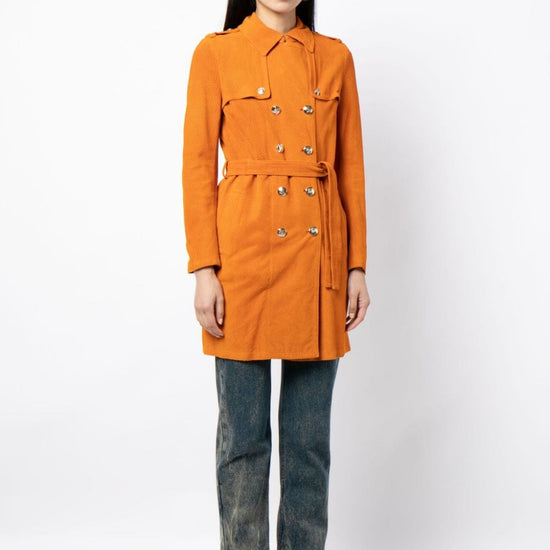 Gucci suede trench coat displayed on a hanger, showcasing its stylish design and rich texture.