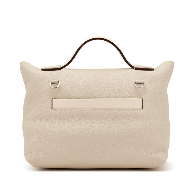 Hermès Nata Togo 24/24 tote bag showing the back side in beige with structured design and subtle branding.