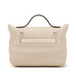 Hermès Nata Togo 24/24 tote bag showing the back side in beige with structured design and subtle branding.