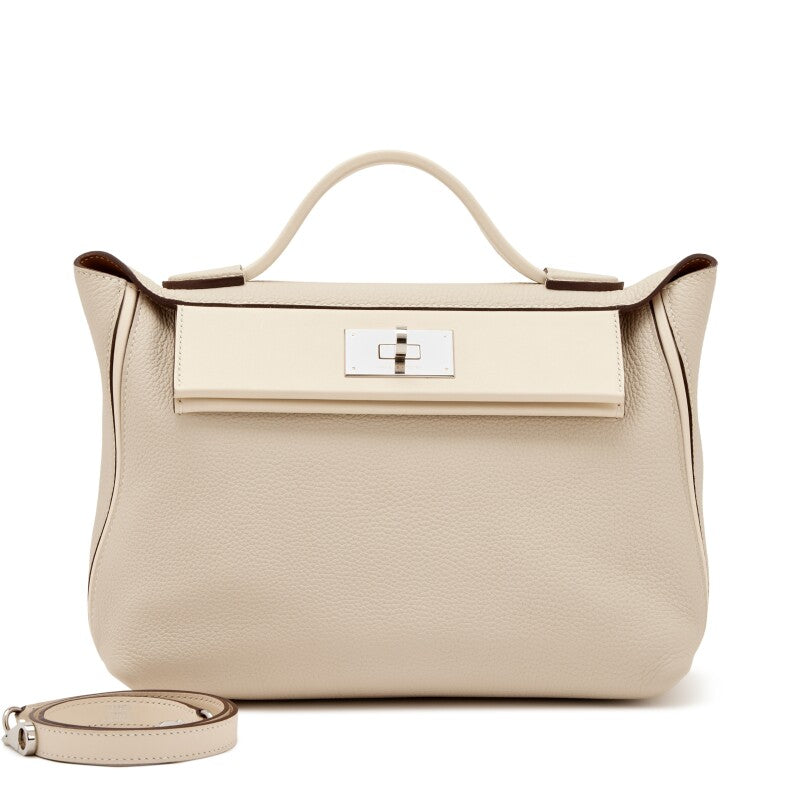 Hermès Nata Togo 24/24 tote bag in pink with structured shape and top handles, showcasing elegant leather craftsmanship.