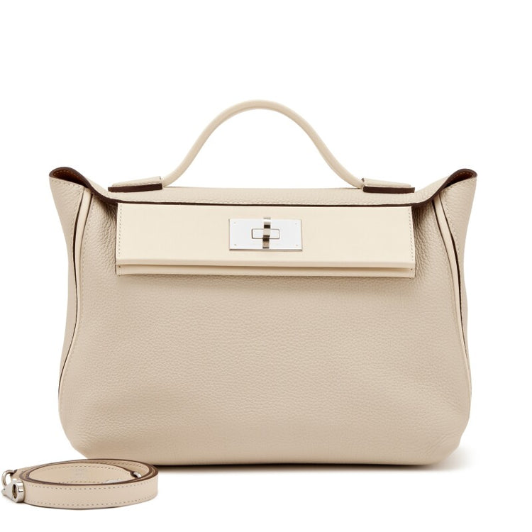 Hermès Nata Togo 24/24 tote bag in pink with structured shape and top handles, showcasing elegant leather craftsmanship.