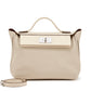 Hermès Nata Togo 24/24 tote bag in pink with structured shape and top handles, showcasing elegant leather craftsmanship.