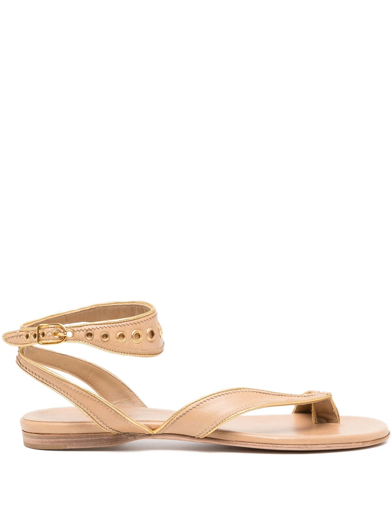 Beige sandal with gold accents on a white background