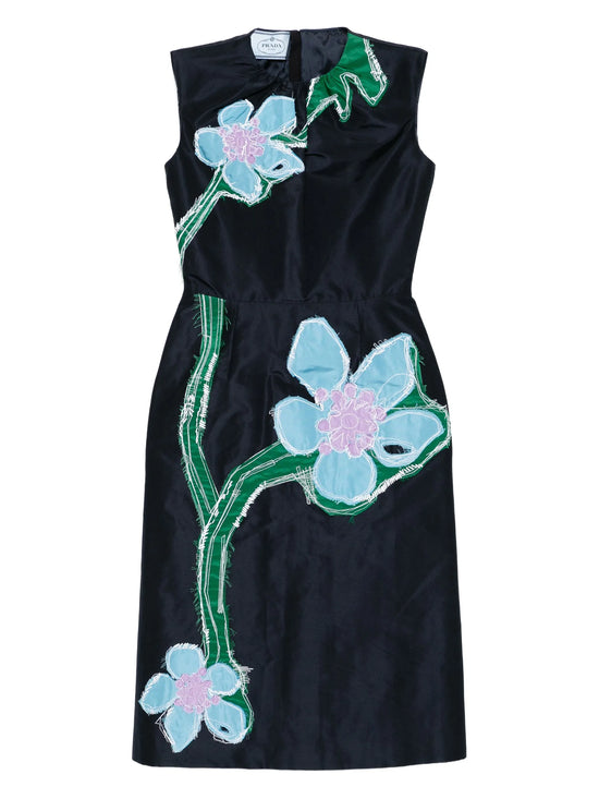 Black dress with floral designs on a white background