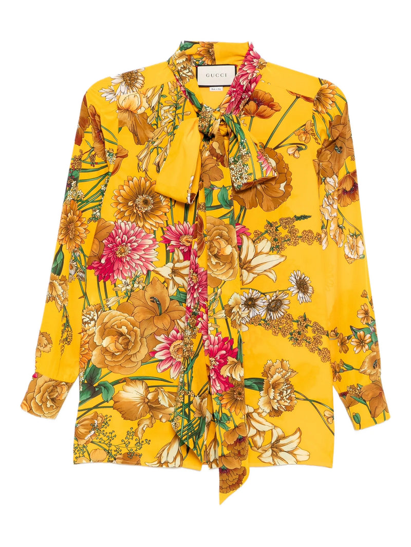 Gucci Yellow floral blouse with a brand logo on a white background