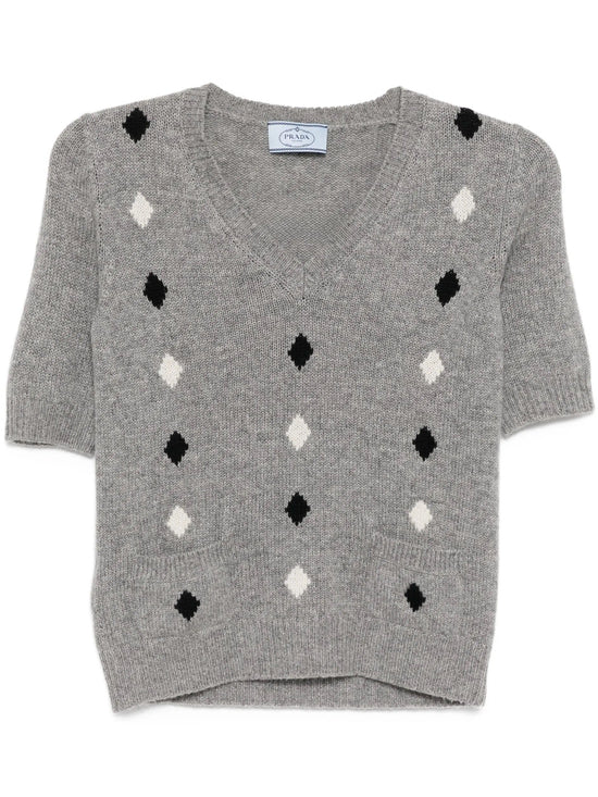Prada grey short-sleeve knit top with a fitted design, featuring a round neckline and textured fabric, casual stylish women’s top.
