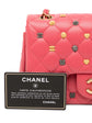 Chanel Classic Studded Flap Bag in Pink with decorative charms and authenticity card.