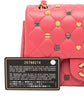 Chanel Classic Studded Flap Bag in Pink with decorative studs and a authenticity label on a white background