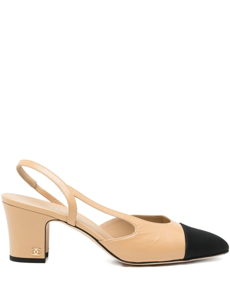 Beige and black high-heeled shoe on a white background